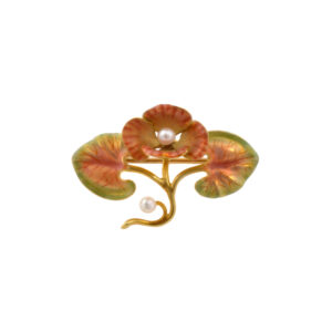 A pearl set enamelled brooch with two pearls, one in the centre of the flower and the other on the flower stem.