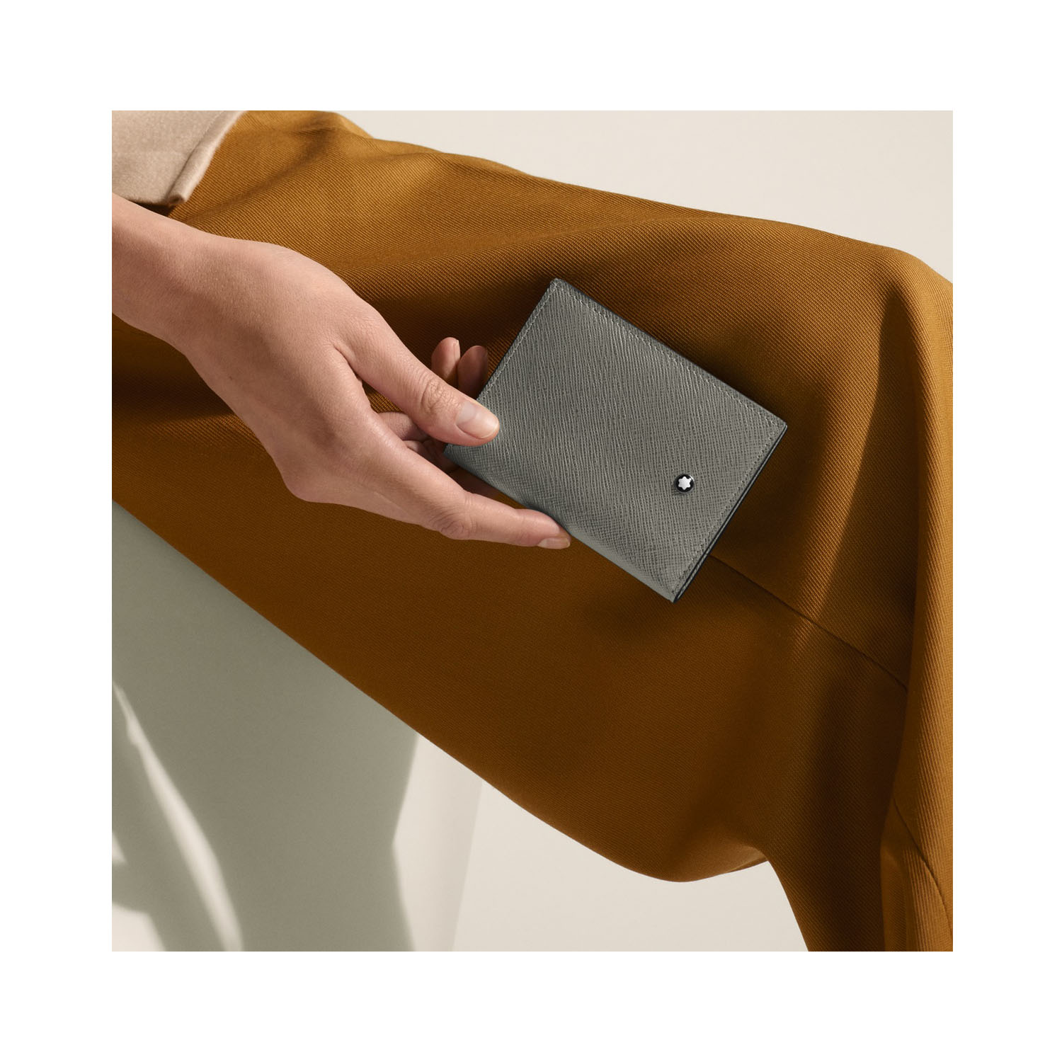 A Montblanc, Sartorial mini wallet craafted in grey Saffiano-printed leather featuring three credit card slots, a banknote compartment and two small additional pockets.