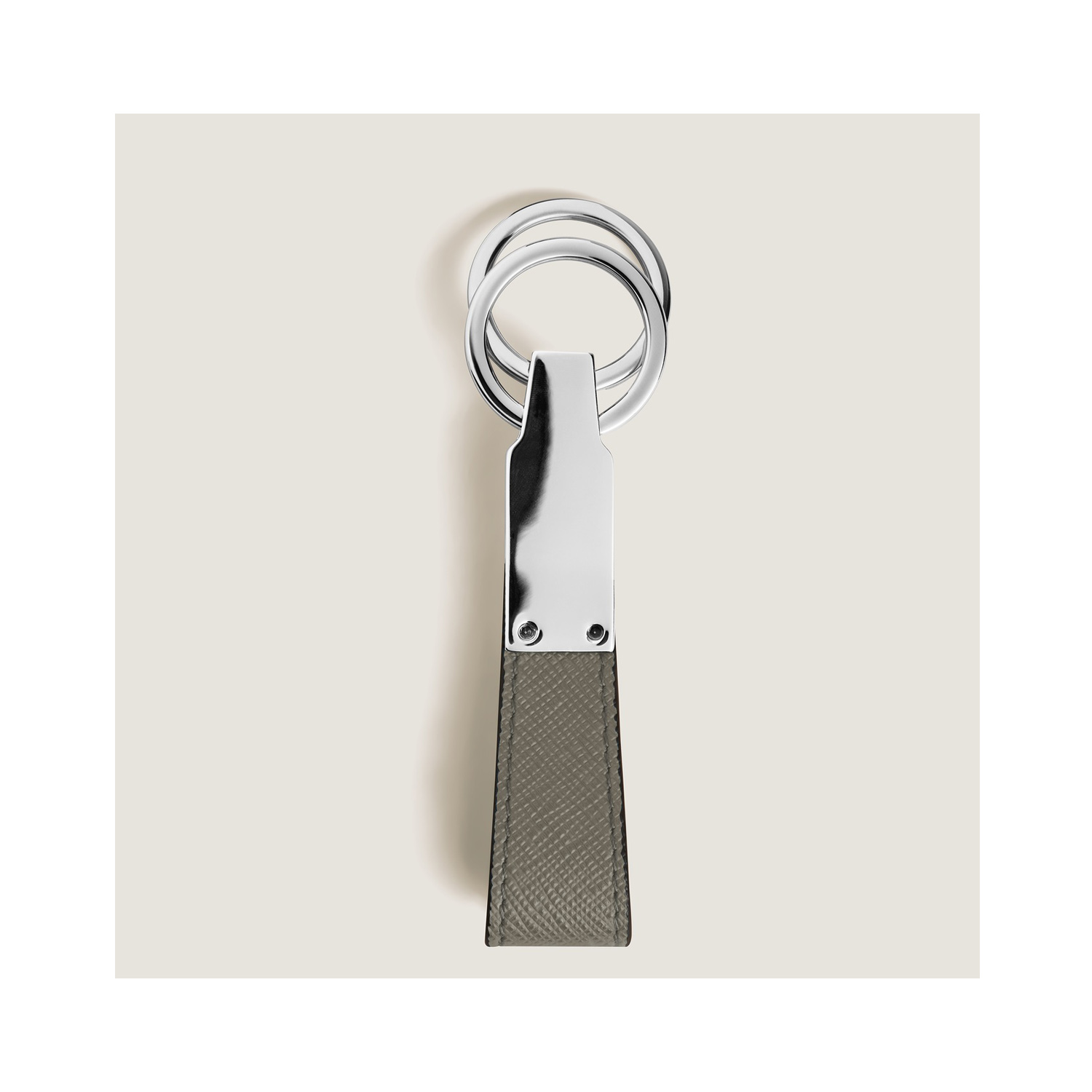 A Montblanc, Sartorial loop key fob crafted in medium grey Saffiano-printed leather and shaped into a loop, featuring increased functionality with the detachable ring to loop in several keys.