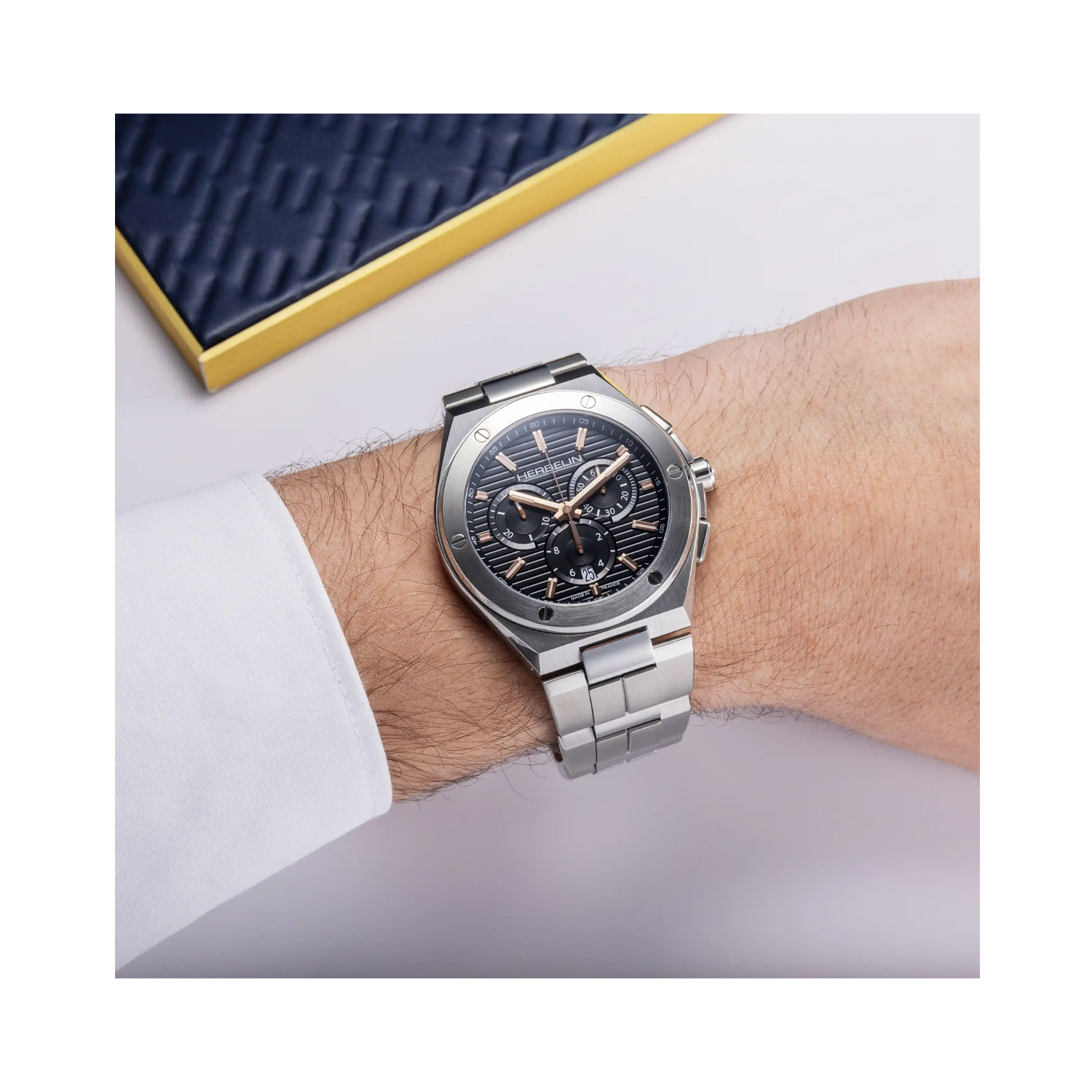 Herbelin, Cap Camarat Chronograph Steel & Rose Gold PVD, Quartz Men's Watch Herbelin, Cap Camarat Chronograph with a 42mm stainless steel case and bracelet strap featuring a date function, chronograph and rose gold PVD coated hands and hour markers.