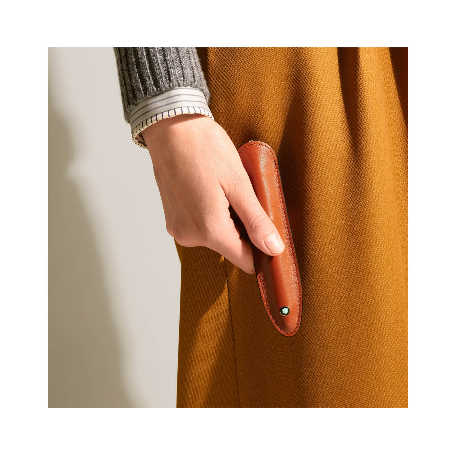 A Montblanc, Meisterstück pen sleeve crafted in elegant rust-colour leather made to carry one writing instrument.