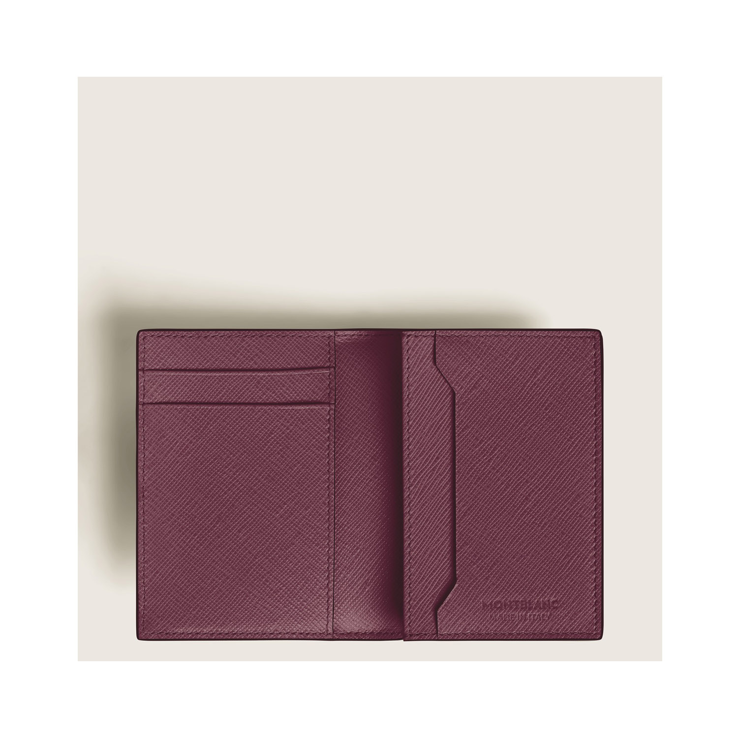A Montblanc, Sartorial brown card reader crafted in Saffiano-printed leather with three interior credit card slots, a business card slot, an additional small pocket with an exterior credit card slot.