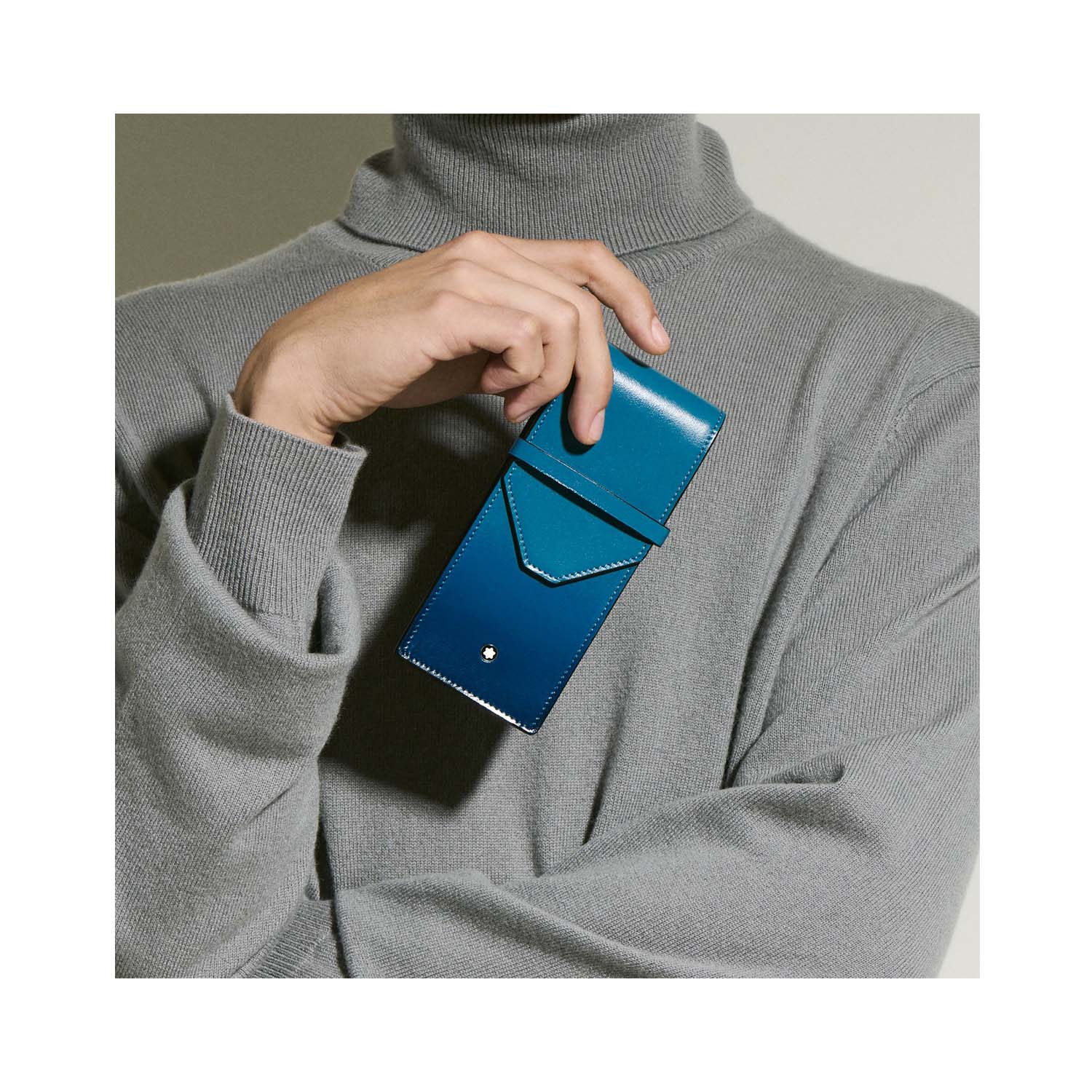 A Montblanc, Meisterstück smoky blue pen pouch crafted in deep shine leather with a hand-applied sfumato effect with space to hold three writing instruments.