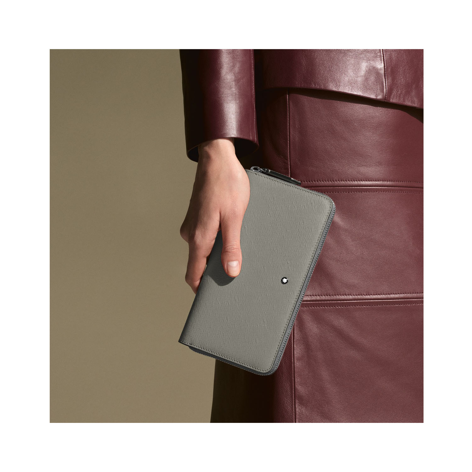 A Montblanc, Sartorial medium grey coloured wallet crafted in Saffiano-printed leather featuring twelve credit card slots, three compartments for banknotes, a dedicated coin case with a zip and three additional small pockets.
