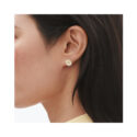 A pair of gold-plated sterling silver white enamel flower ear studs, for pierced ears from Georg Jensen's Daisy collection.