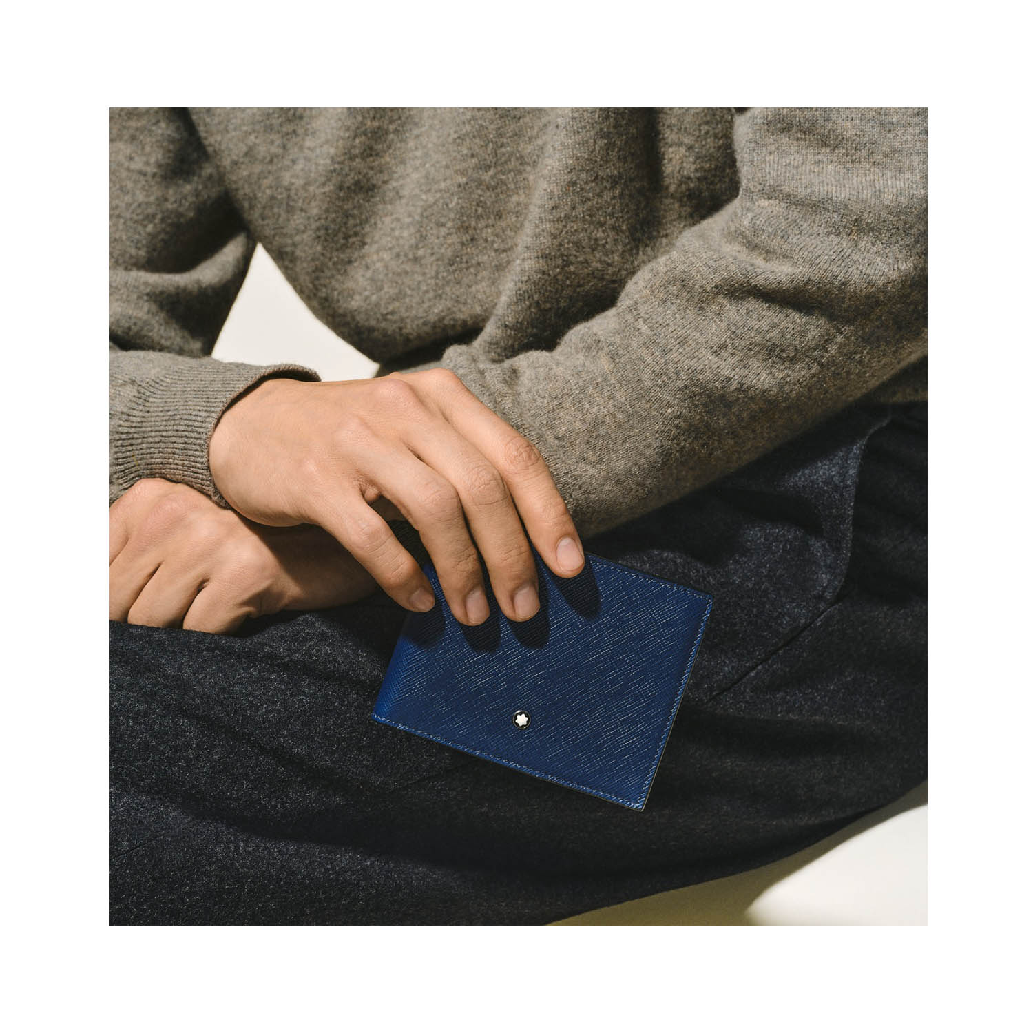 A Montblanc, Meisterstück wallet crafted in luxurious ink blue leather with six credit card slots with a compartment for banknotes and two additional small pockets.