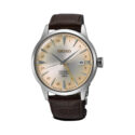 Seiko, Presage ‘Acacia’ Cocktail Time GMT with a 40.5mm stainless steel case and a brown leather strap featuring a date function and a cream coloured dial.