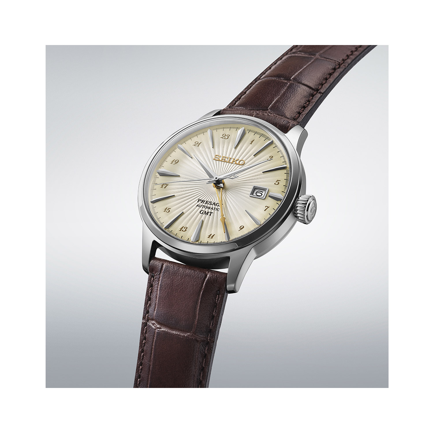 Seiko, Presage ‘Acacia’ Cocktail Time GMT with a 40.5mm stainless steel case and a brown leather strap featuring a date function and a cream coloured dial.