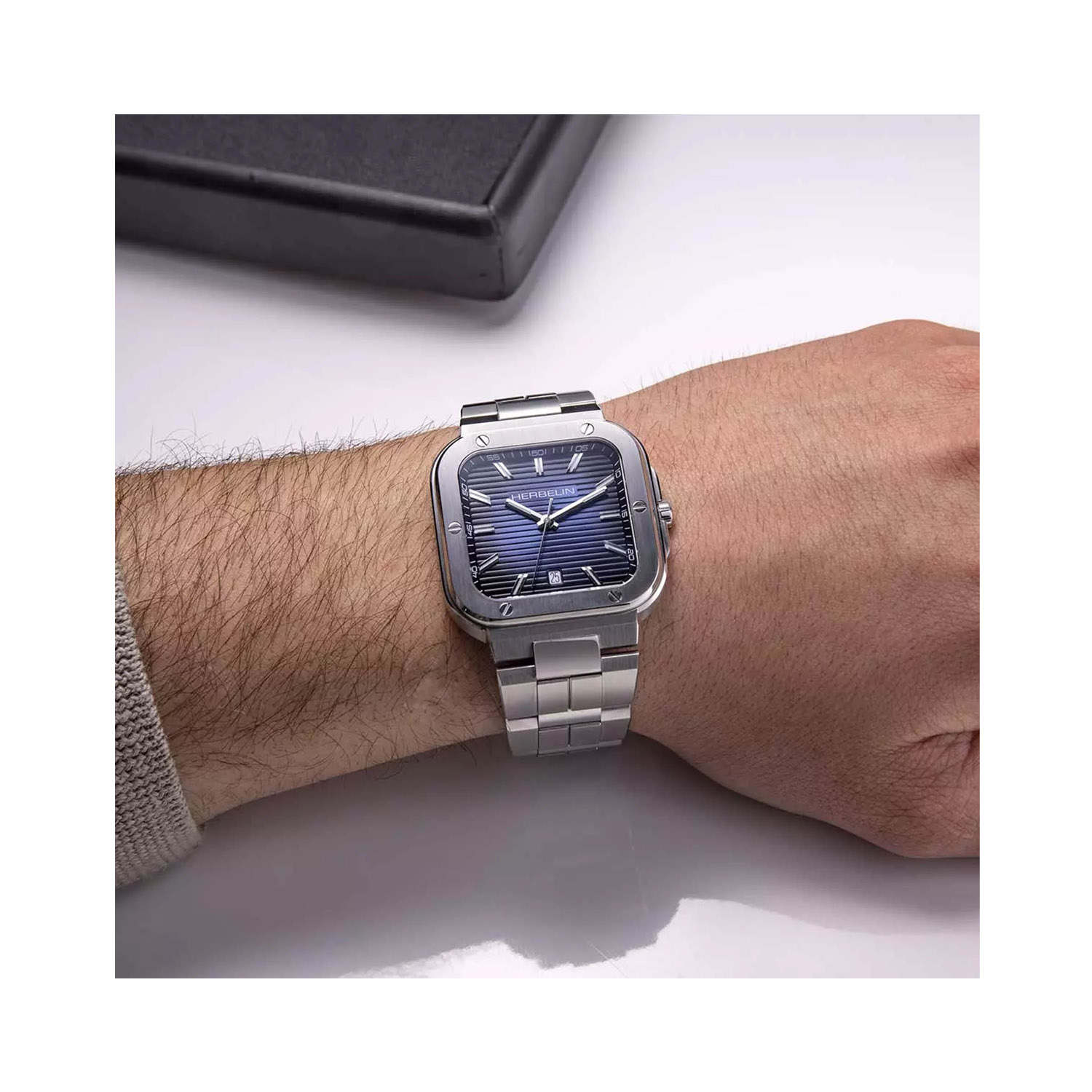 Herbelin, Cap Camarat Square with a 39mm stainless steel case and bracelet strap featuring a date function and a blue dial.