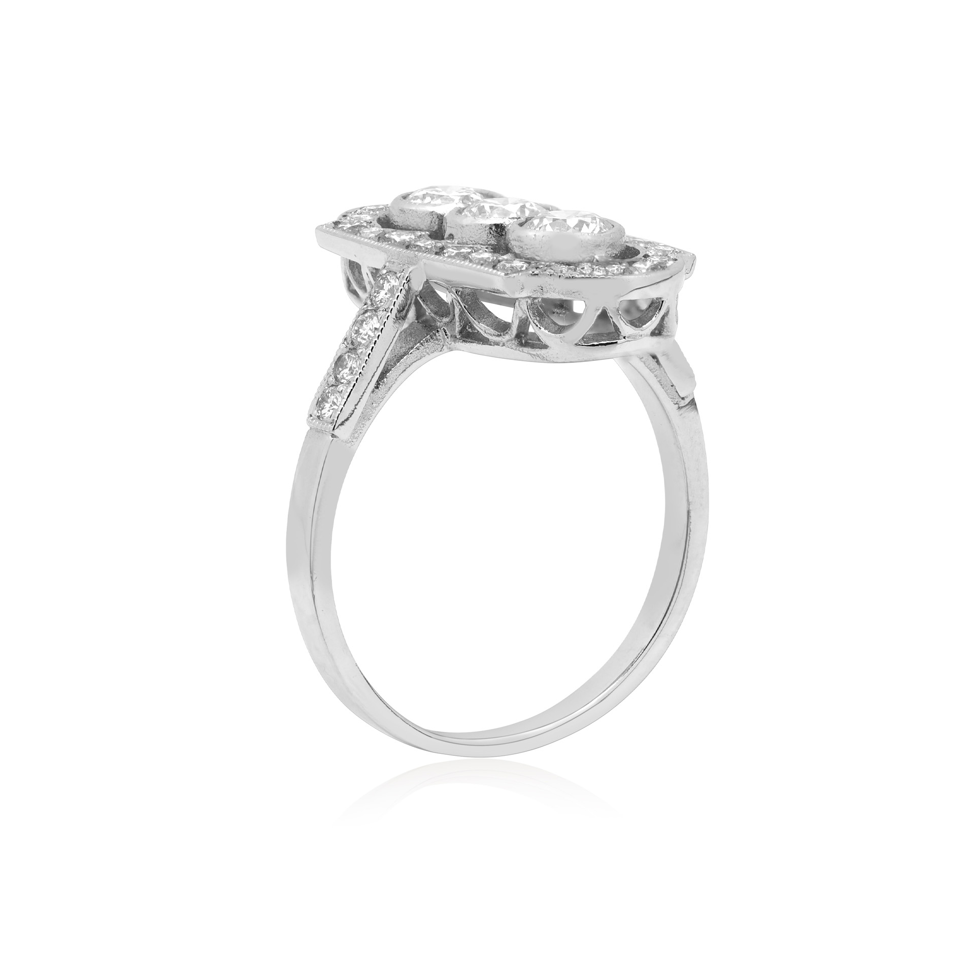 A platinum diamond plaque ring with rubover and millegrain settings and diamond set shoulders.