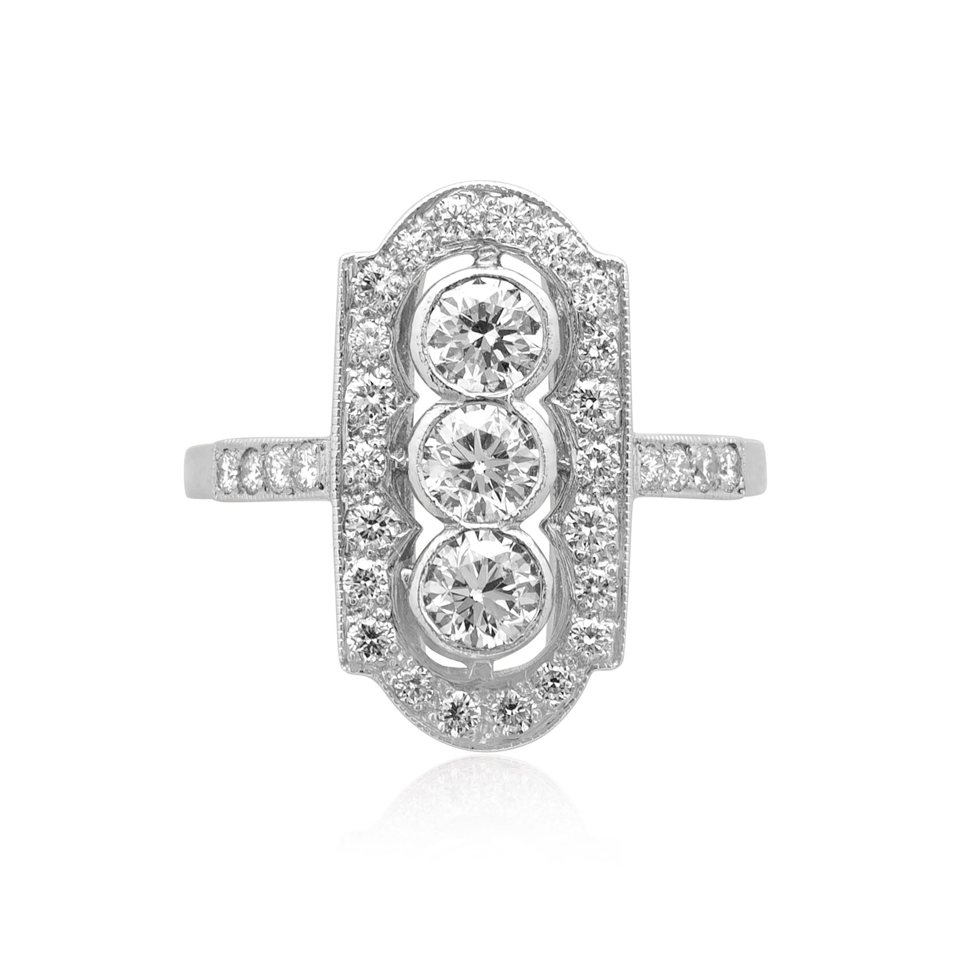 A platinum diamond plaque ring with rubover and millegrain settings and diamond set shoulders.