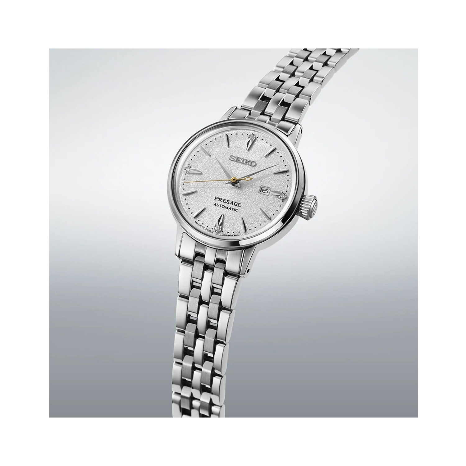 Seiko, Presage ‘Hot Buttered Rum’ Diamond Set Cocktail Time with a 30.3mm stainless steel case and bracelet strap featuring a date function and a silver diamond set dial.