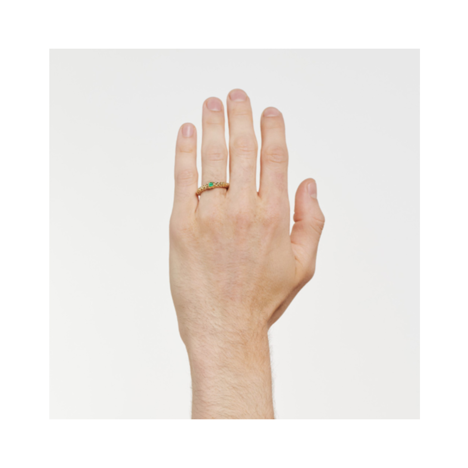 An 18ct rose gold Flex'It ring with a single green emerald belonging to FOPE's Souls collection.