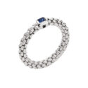 An 18ct white gold Flex'It bracelet set with a single blue sapphire belonging to FOPE's Souls collection.