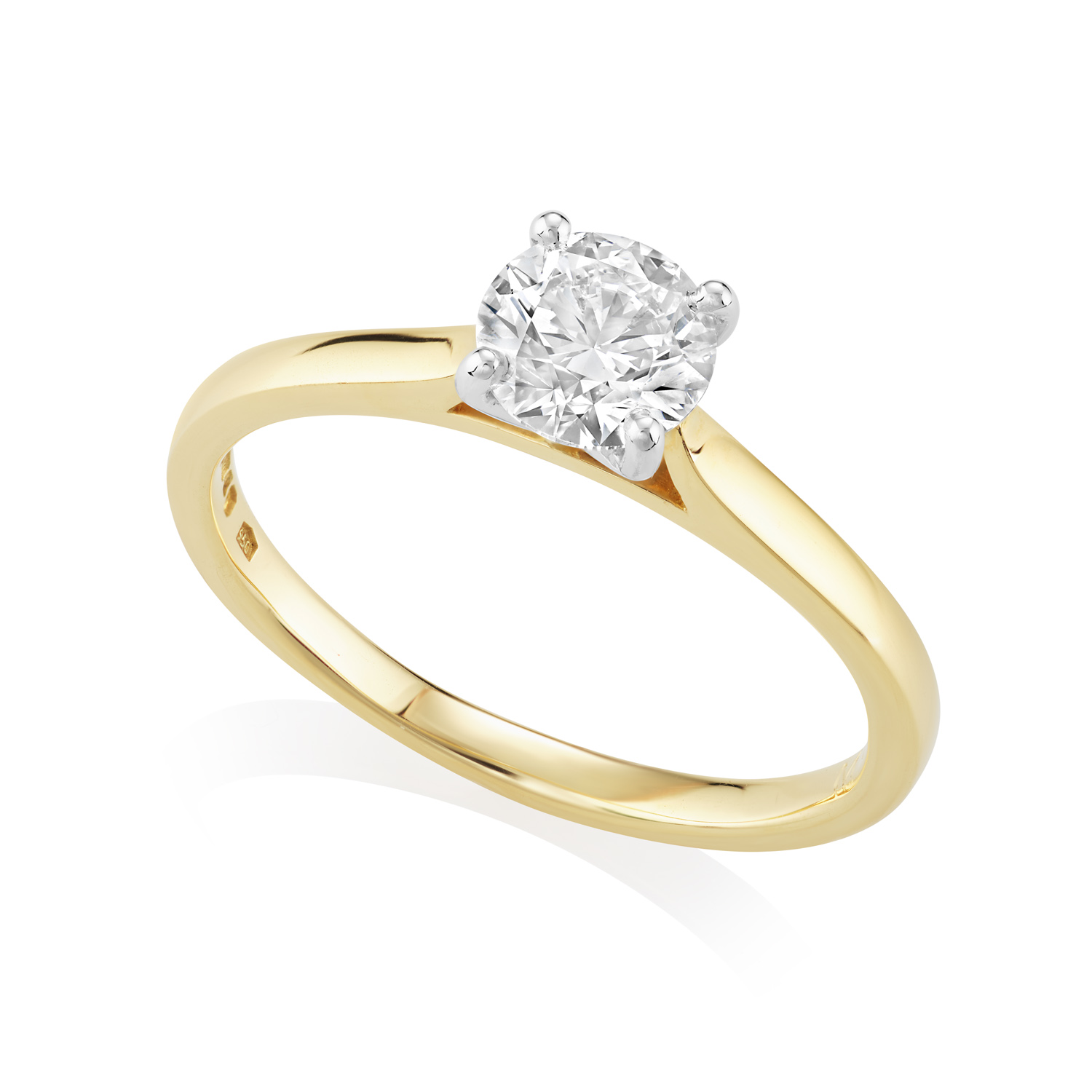 18ct Yellow Gold & Platinum Leon Collection Round Brilliant Cut Diamond Ring: 0.72 carats An 18ct yellow gold and platinum round brilliant cut, four claw set diamond single stone ring belonging to H. L. Brown's Leon collection.