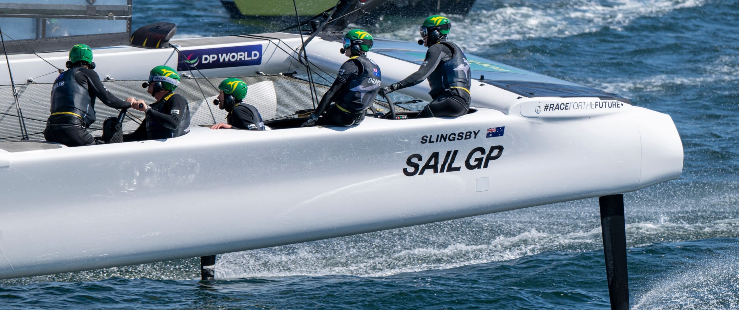 Sail team on boat in water