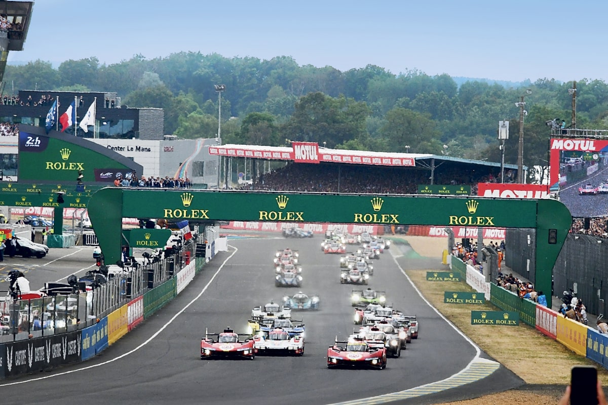 Cars racing on track