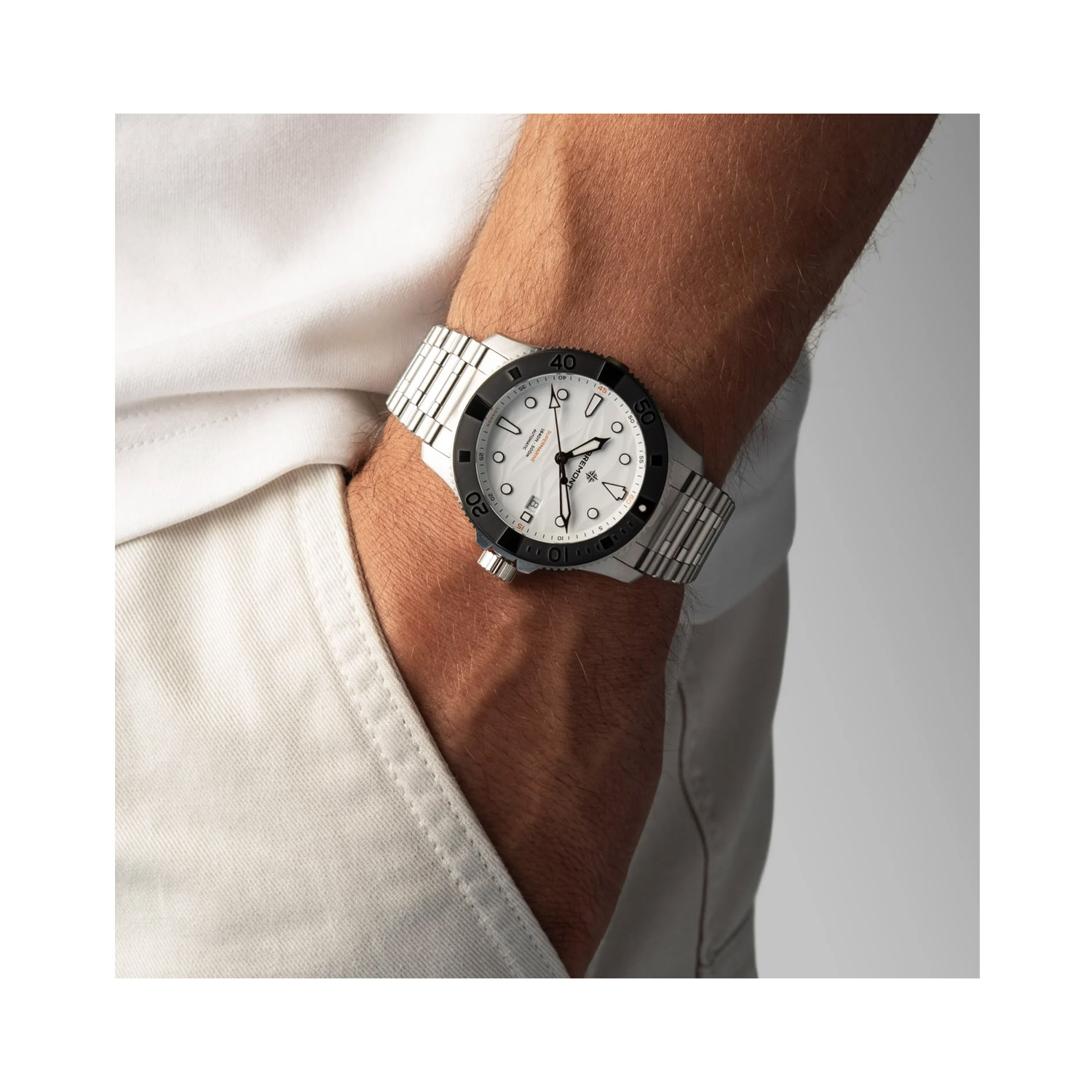 Bremont, Supermarine 500m 'Polar White', Automatic Men's Watch Bremont, Supermarine 500m 'Polar White' with a 43mm stainless steel case and bracelet strap featuring a date function and a white wave patterned dial.