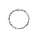 An 18ct white gold Flex'It bracelet with one diamond set and one polished rondel, belonging to FOPE's Solo collection.