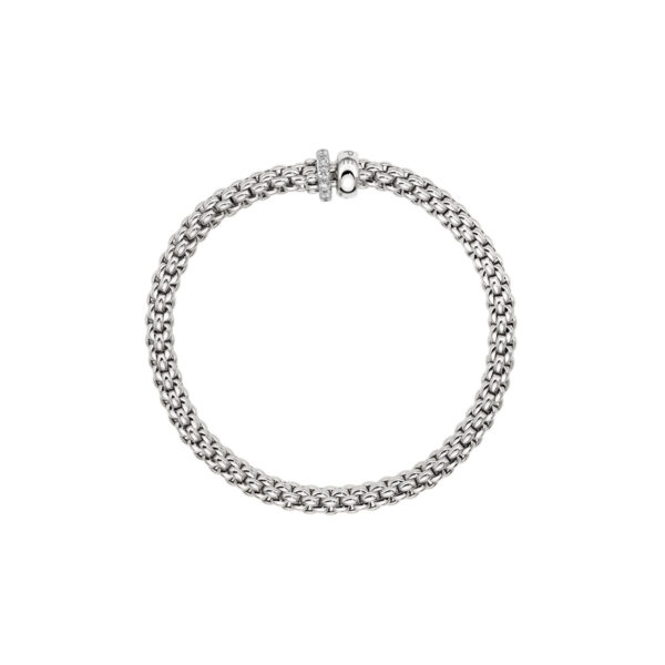 An 18ct white gold Flex'It bracelet with one diamond set and one polished rondel, belonging to FOPE's Solo collection.