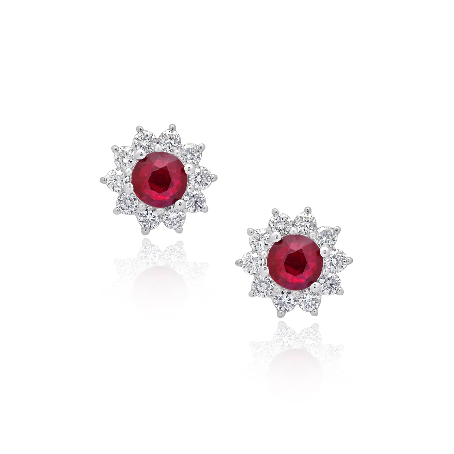 A pair of 18ct white gold ruby and round brilliant cut diamond cluster stud earrings, for pierced ears.