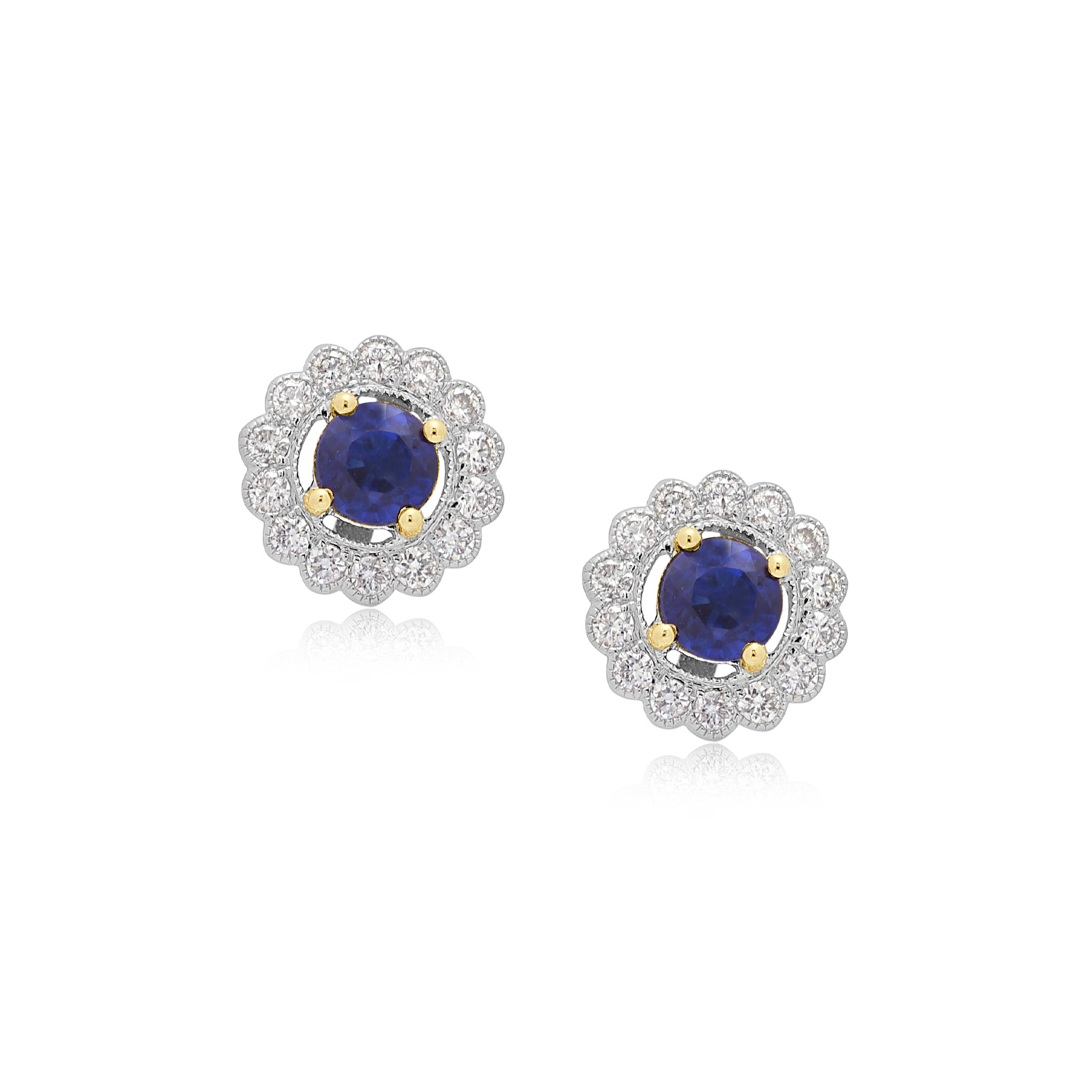 A pair of 18ct white and yellow gold sapphire and diamond stud earrings, for pierced ears.