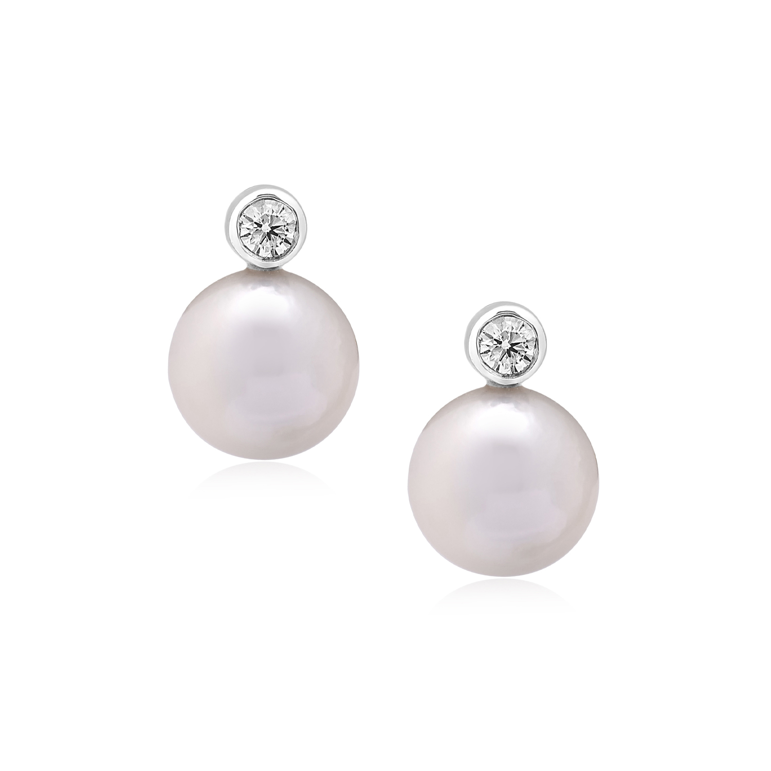 A pair of 18ct white gold akoya pearl and rub over diamond set drop earrings, for pierced ears.