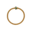 An 18ct yellow gold Flex'It bracelet with an emerald and diamond rondel and a polished diamond set rondel, belonging to FOPE's Solo collection.