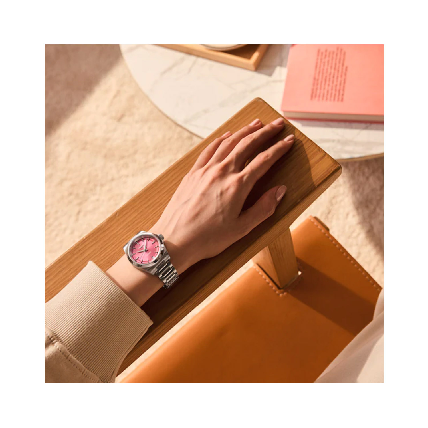 Longines, Conquest with a 34mm stainless steel case and bracelet strap featuring a date function and a pink dial.