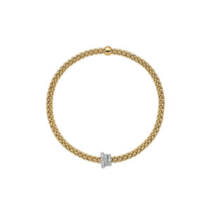 An 18ct yellow gold Flex'It bracelet with three pave diamond set rondels in white gold belonging to FOPE's Prima collection.