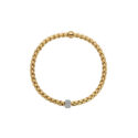 FOPE, EKA Tiny Collection, 18ct Yellow Gold Pave Diamond Flex’It Bracelet: 0.19 carats An 18ct yellow gold Flex'It bracelet with a white gold pave diamond set rondel belonging to FOPE's EKA Tiny collection.