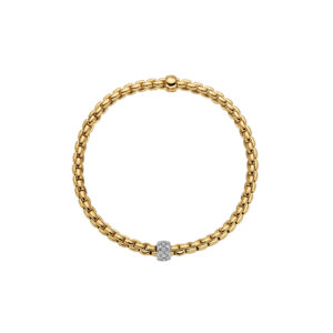 An 18ct yellow gold Flex'It bracelet with a white gold pave diamond set rondel belonging to FOPE's EKA Tiny collection.