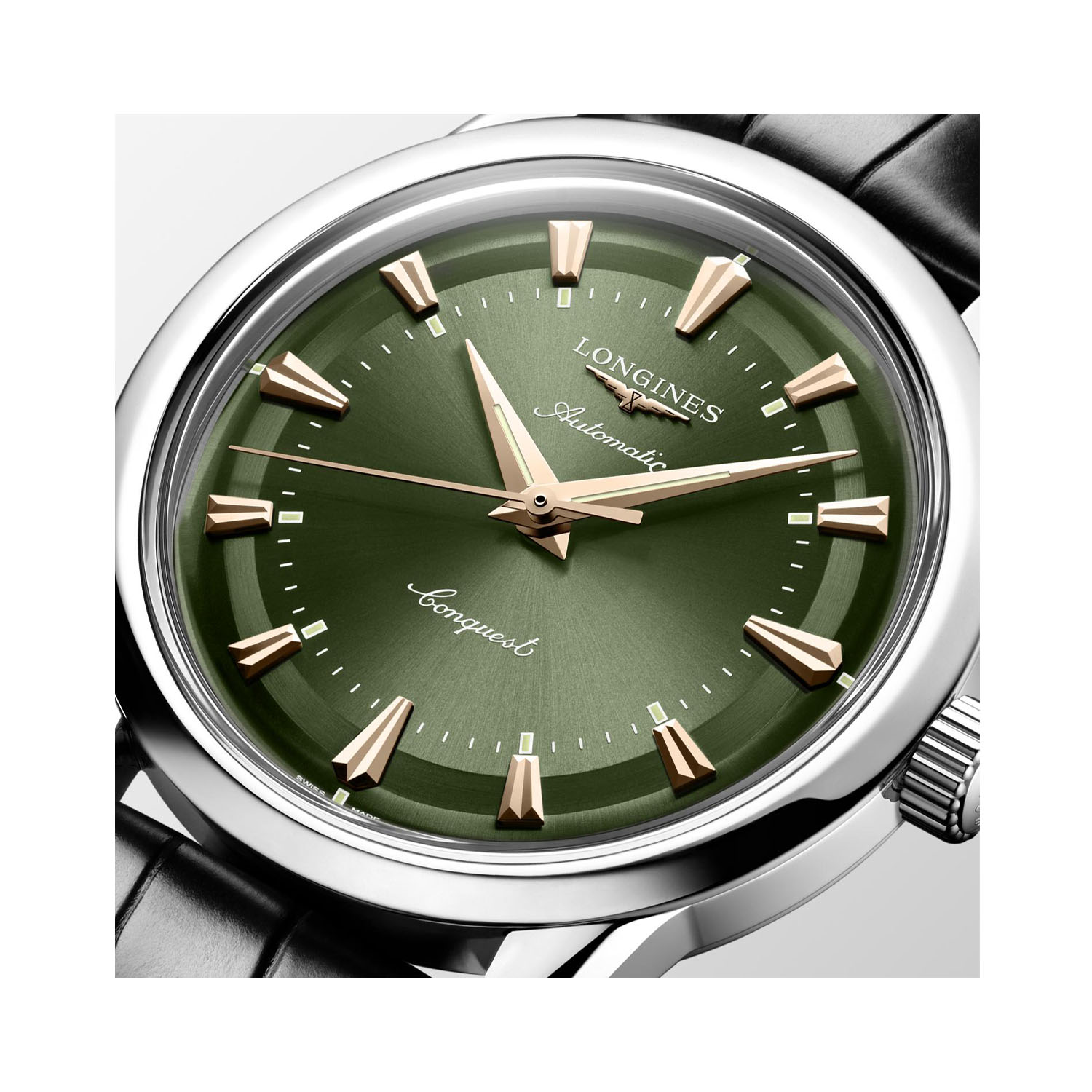 Longines, Conquest Heritage with a 38mm stainless steel case and a black leather strap featuring a green dial with rose gold toned hands.