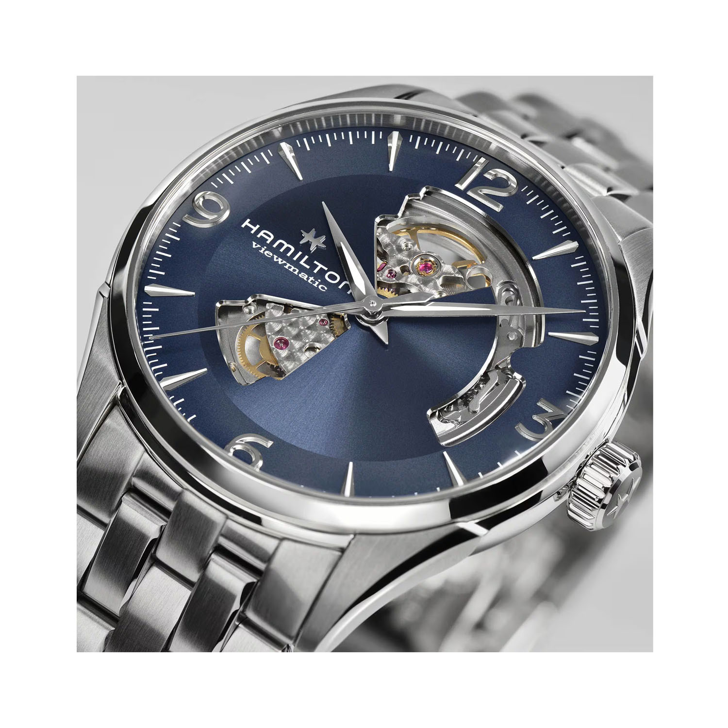 Hamilton, Jazzmaster Open Heart with a 42mm stainless steel case and bracelet strap featuring a blue open dial.