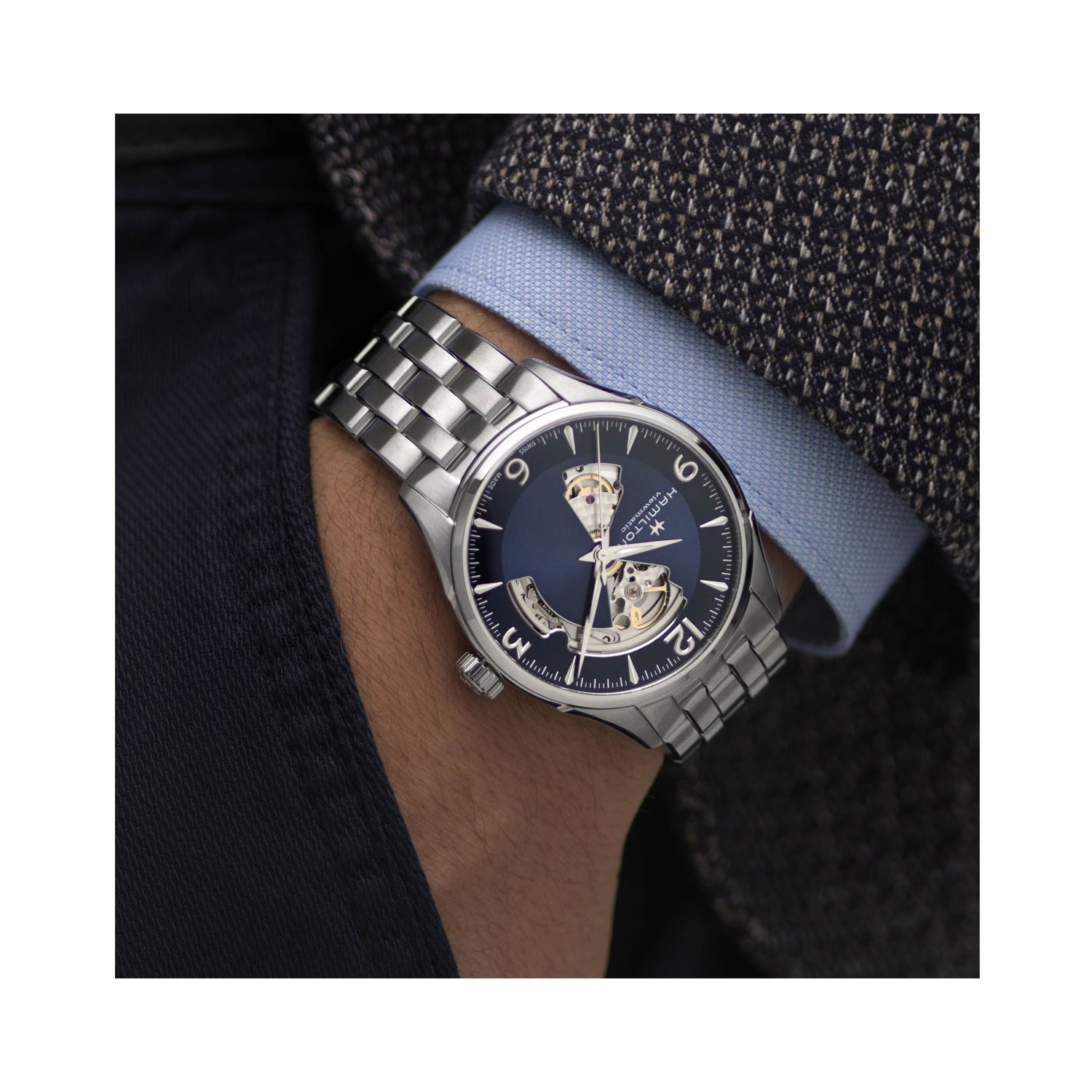 Hamilton, Jazzmaster Open Heart with a 42mm stainless steel case and bracelet strap featuring a blue open dial.
