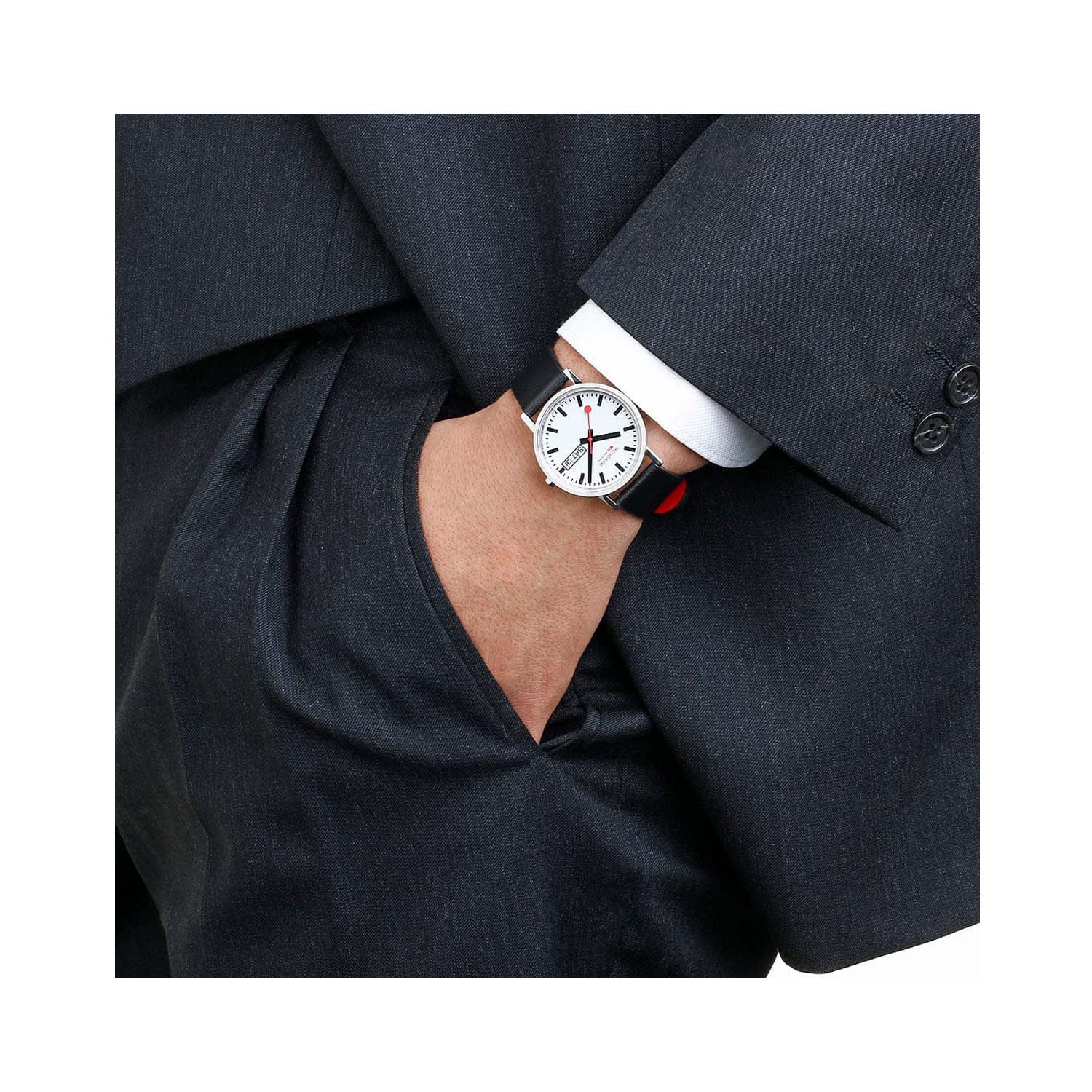 Mondaine, Classic Black Vegan Grape Leather Strap, Unisex Quartz Watch Mondaine, Classic Day Date with a 36mm stainless steel case and a black vegan grape leather strap featuring a day date function and white dial.