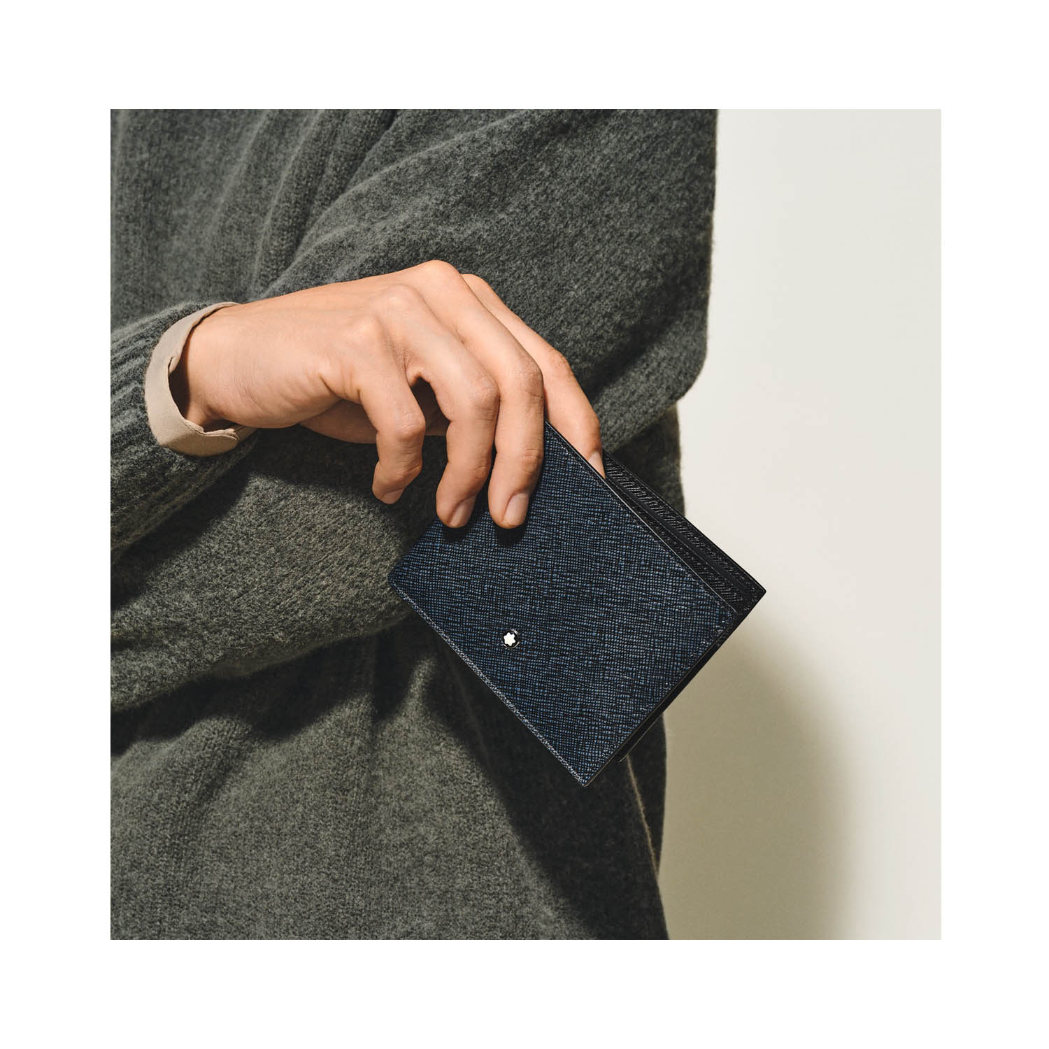 Montblanc, Sartorial Tweed Blue 6cc Wallet Montblanc, Sartorial wallet crafted in tweed blue leather with six dedicated spaces for cards, two compartments for banknotes and two additional smaller pockets.