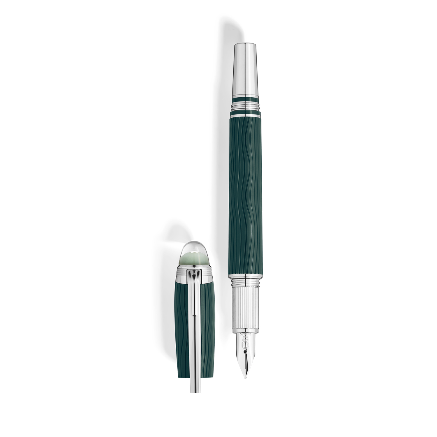A Montblanc, StarWalker PolarGreen Fountain Pen crafted in green precious resin with platinum coated fittings, a hand-crafted Au 585 14ct gold, rhodium coated nib and a dome made from transparent resin with the Montblanc emblem that glows in low light.