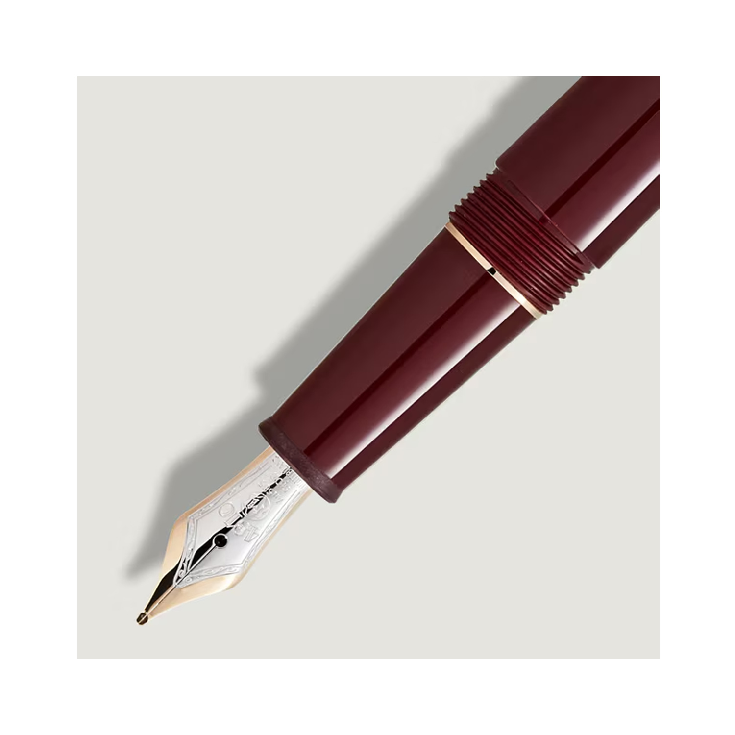 A Montblanc, Meisterstück Burgundy Red Classique Fountain Pen crafted from red precious resin with gold coated fittings and a hand-crafted Au585 14ct gold nib.