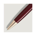 A Montblanc, Meisterstück Burgundy Red Ballpoint pen crafted from red precious resin with gold coated fittings.