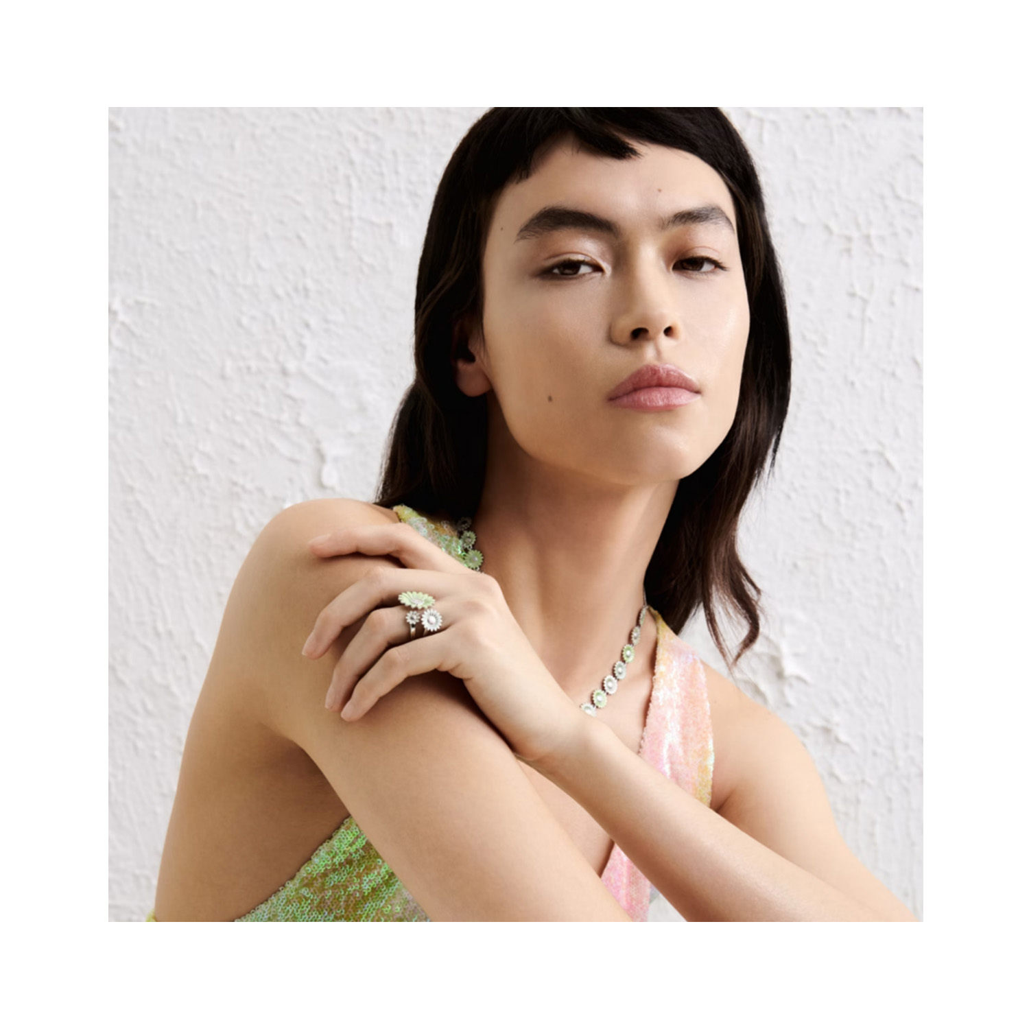 A rhodium plated, sterling silver green and white enamelled flower necklace from Georg Jensen's Daisy collection.