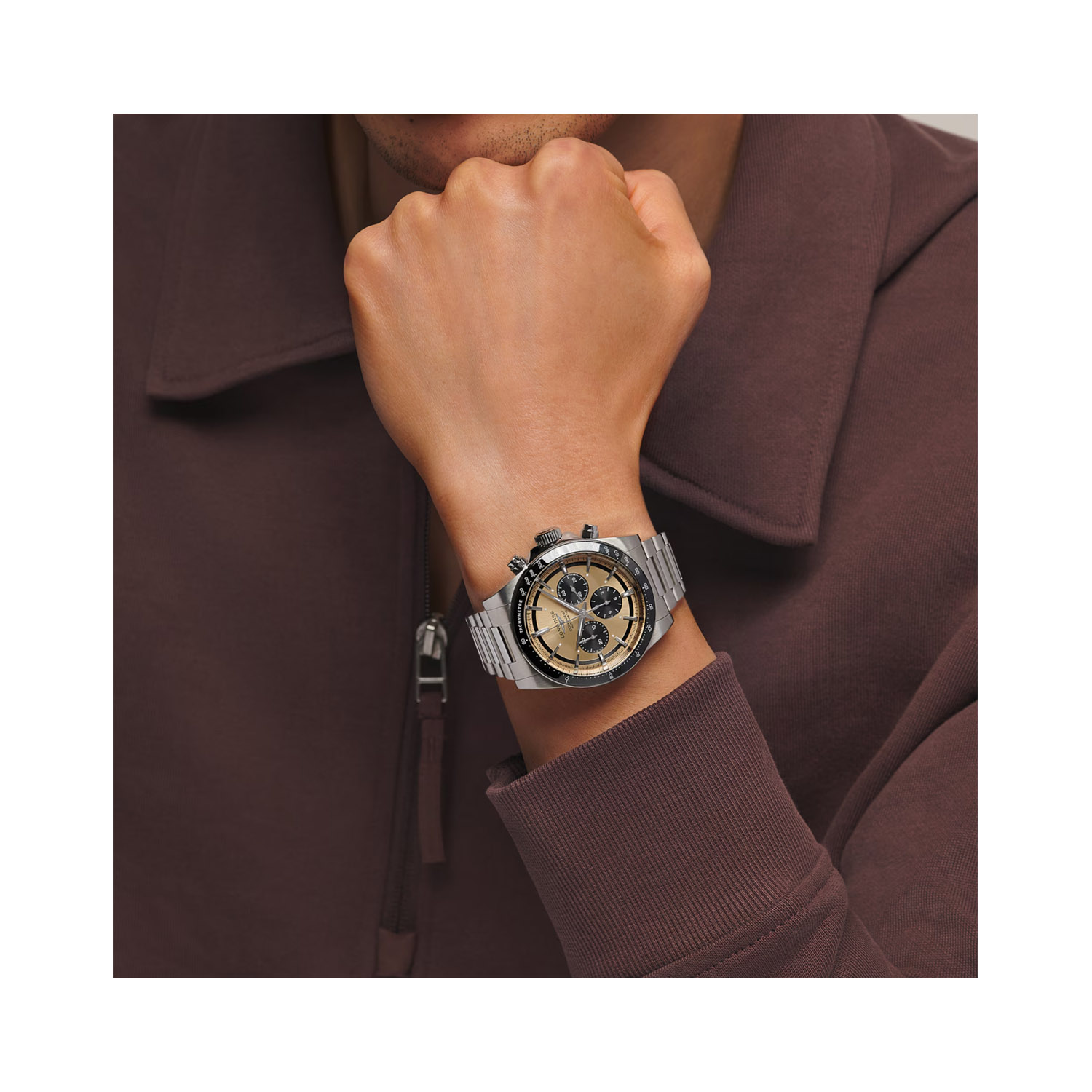 Longines, Conquest with a 42mm stainless steel case and bracelet strap featuring a chronograph and a sunray brown dial with a black bezel.