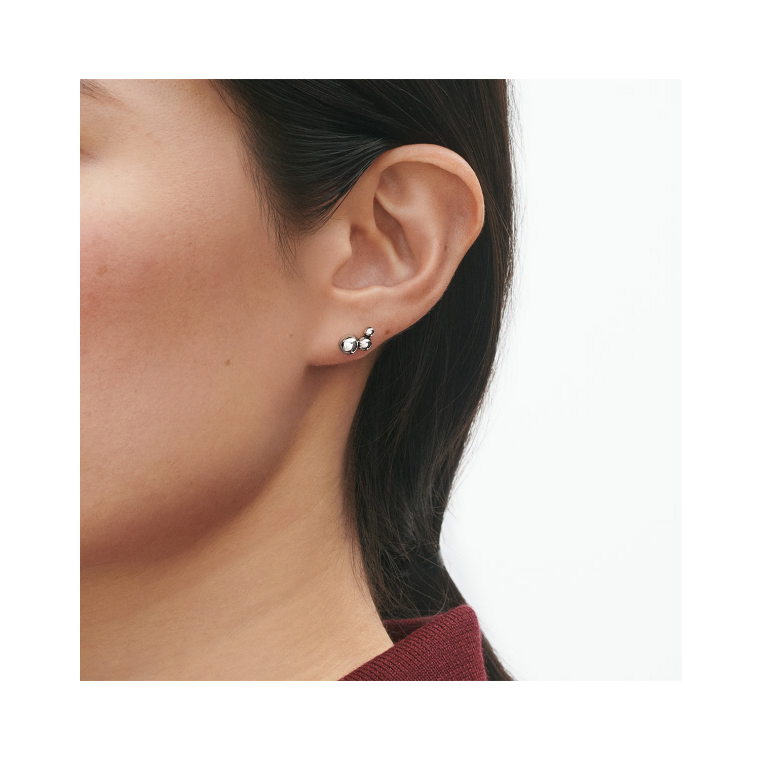 A pair of sterling silver stud earrings from Georg Jensen’s Moonlight Grapes collection, for pierced ears.