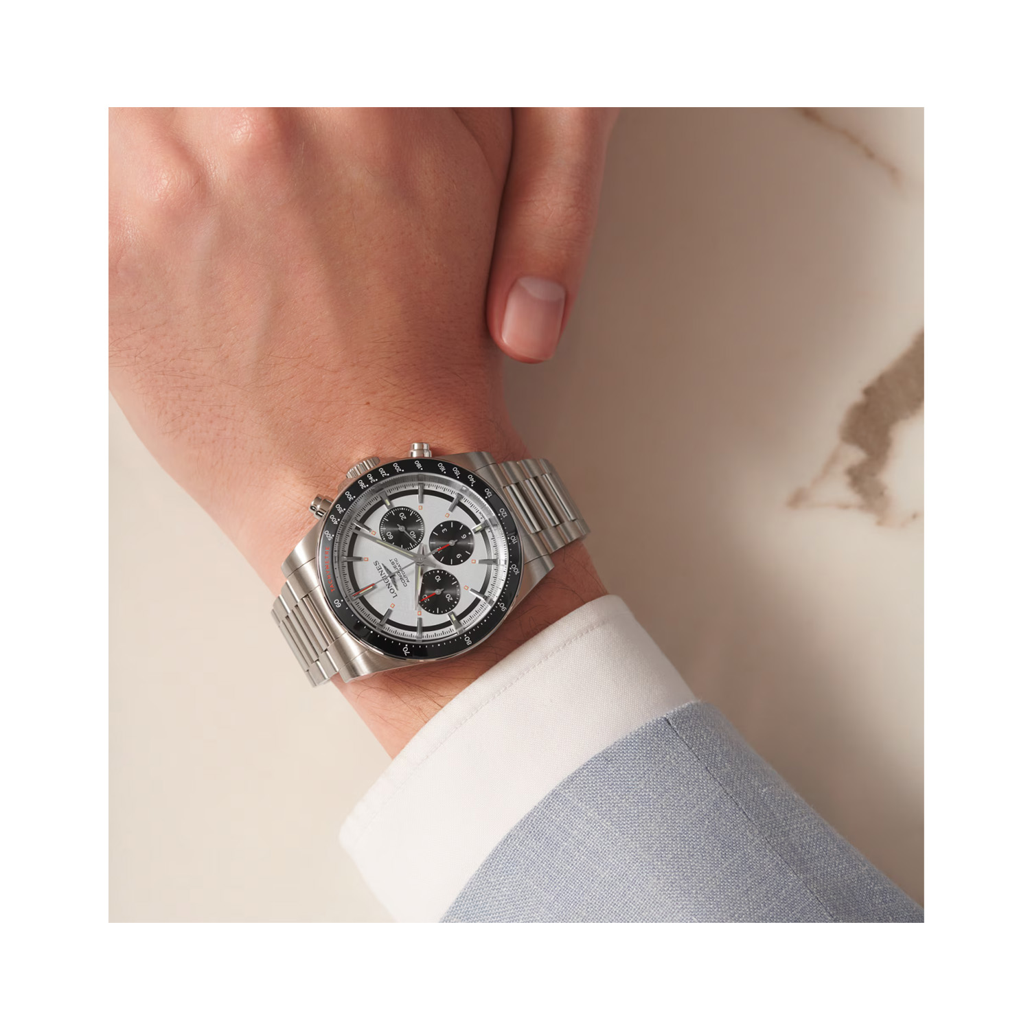 Longines, Conquest Chronograph, Automatic Men's Watch Longines, Conquest with a 42mm stainless steel case and bracelet strap featuring a chronograph, a silver and black dial with a black ceramic bezel.