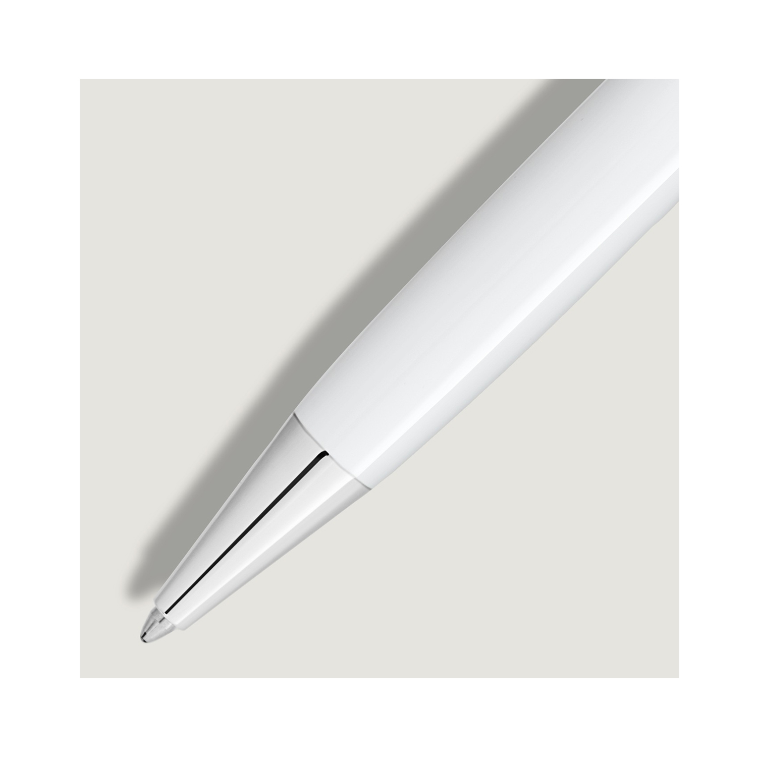 A Montblanc, Meisterstück White Classique Ballpoint pen crafted from white precious resin featuring platinum-coated fittings with the Montblanc emblem on the cap top.