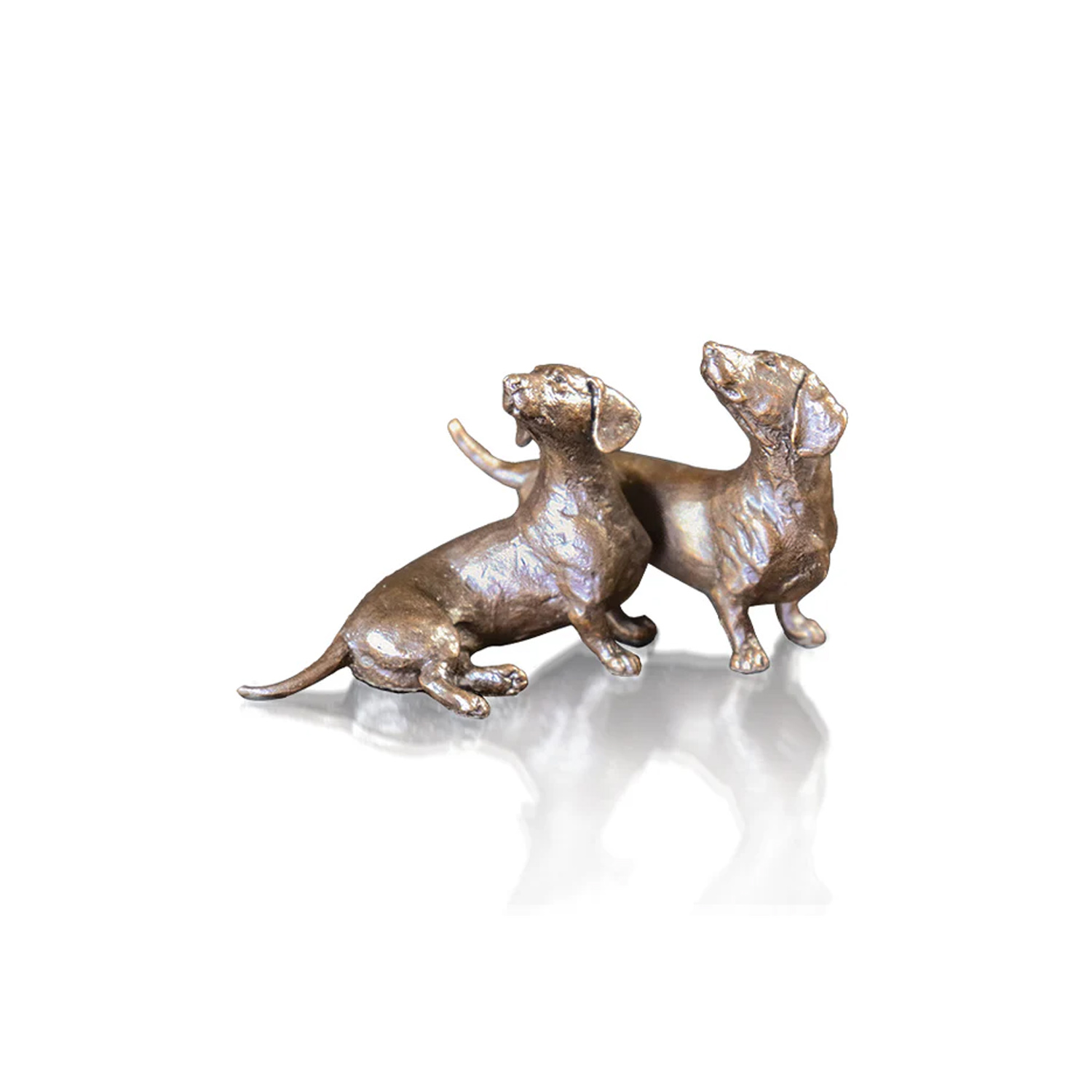 Made from solid foundry bronze, this piece depicts two cuddling Dachshund dogs.