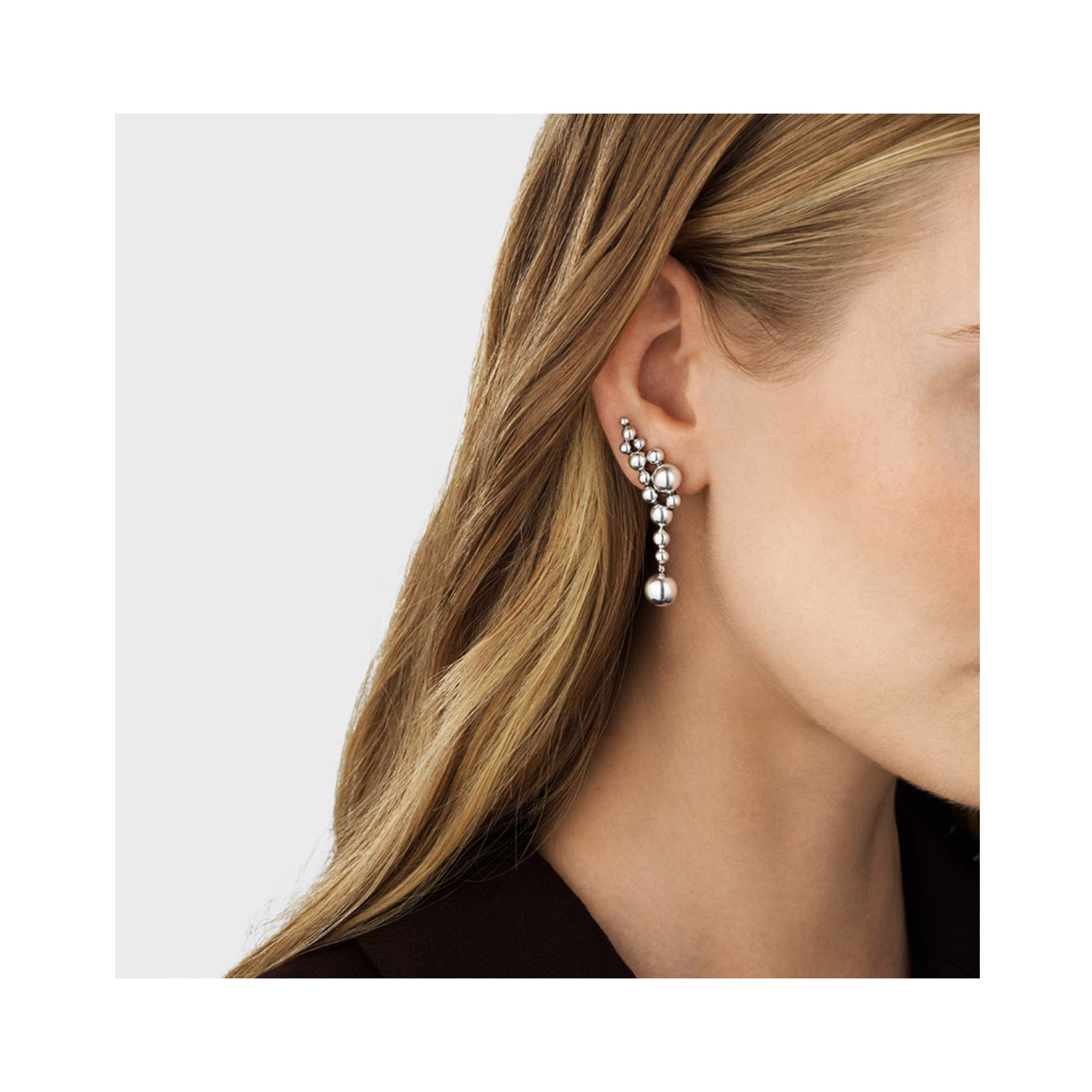 Sterling silver ear cuffs belonging to Georg Jensen's Moonlight Grapes collection, for pierced ears. The items can be purchased as single items or as a matching pair.
