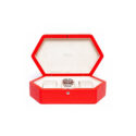 A hexagonal shaped watch box in premium grained red leather that holds up to three watches.