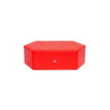 A hexagonal shaped watch box in premium grained red leather that holds up to three watches.