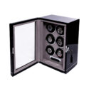 A black lacquered watch winder with space for six watches on patented leather cushions.